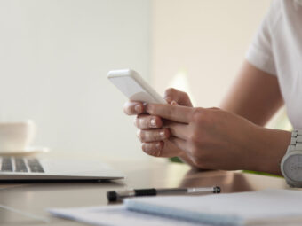 Businesswoman looking important contact on phone